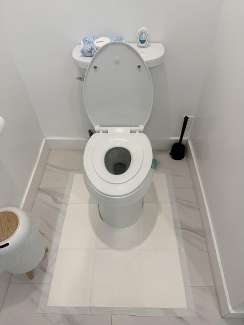 Customer photo of a U-Zorb pad placed around a toilet base